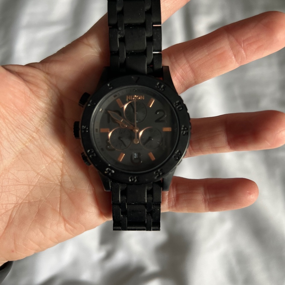 Black and rose gold Nixon watch